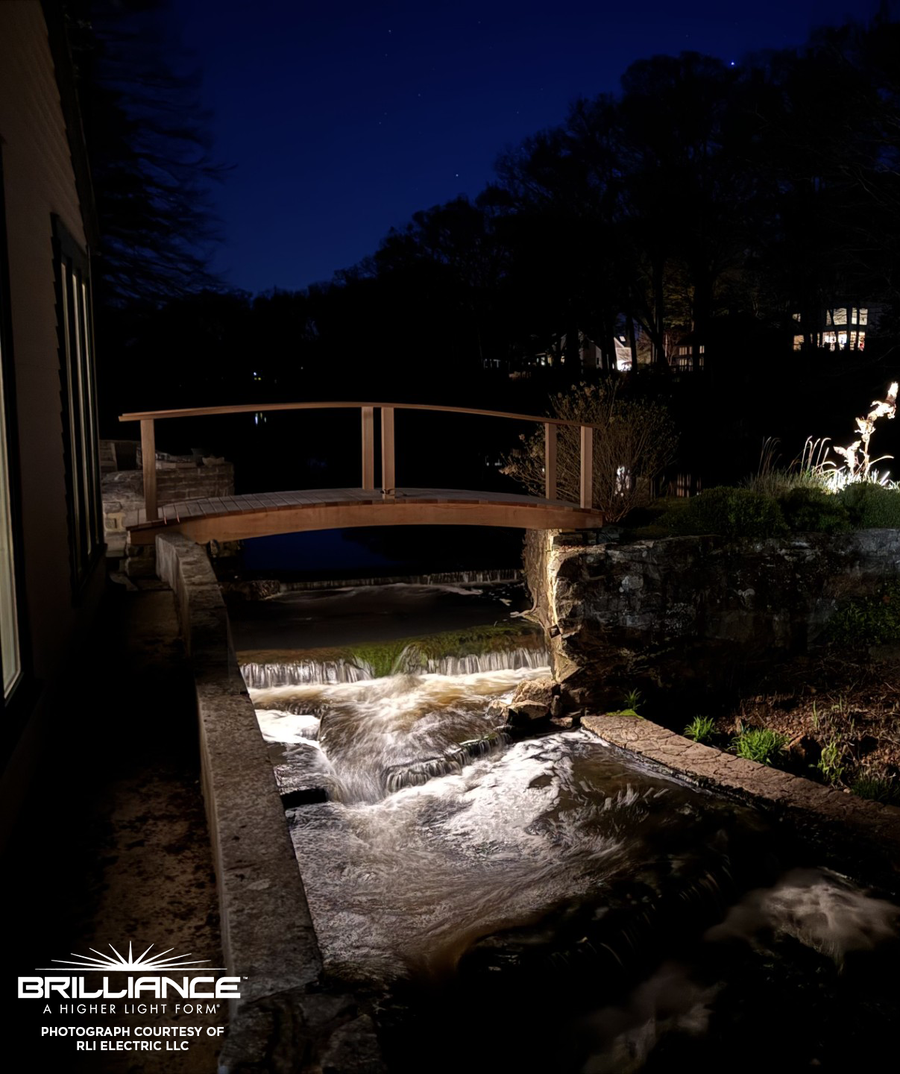 Brilliance LED strip lighting beneath a bridge over a water feature
