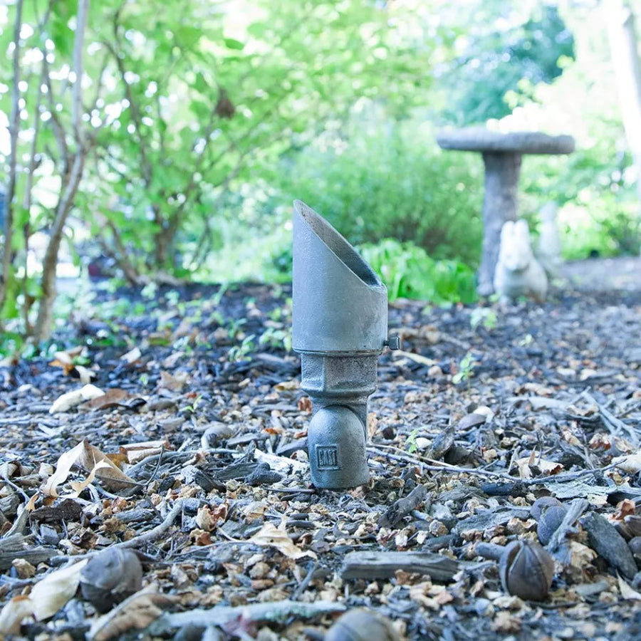 CAST CBLED141 integrated LED bronze spotlight illuminating a garden