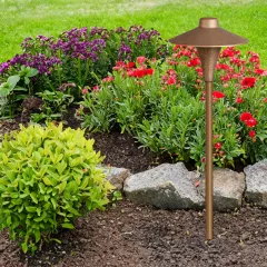 CAST CCH1CB Small China Hat bronze path light installed in a garden
