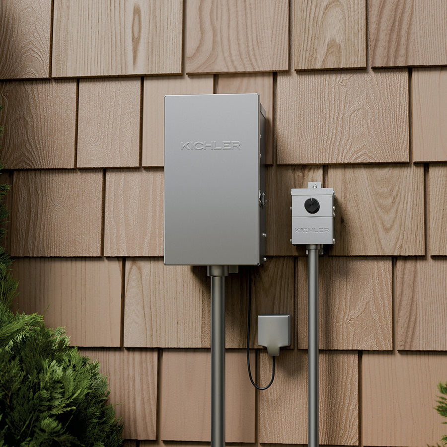 Kichler 15DM20SS PLC landscape dimmer installed on exterior wall with landscape lighting