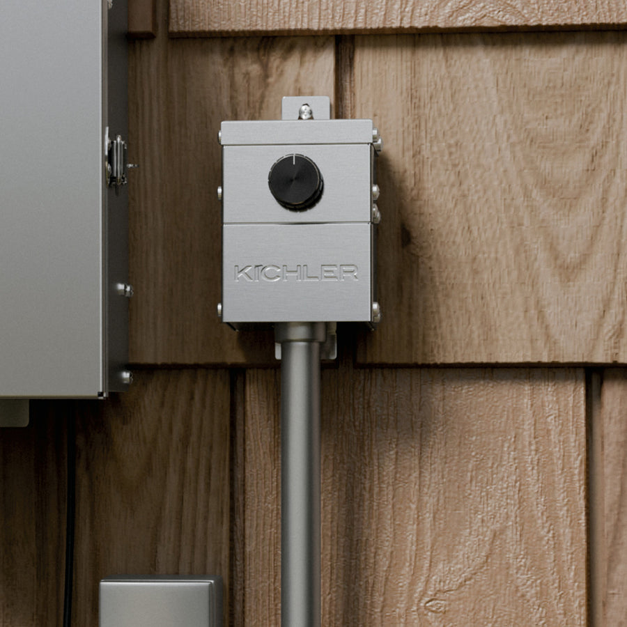 Kichler 15DM20SS PLC landscape dimmer installed outdoors on exterior wall