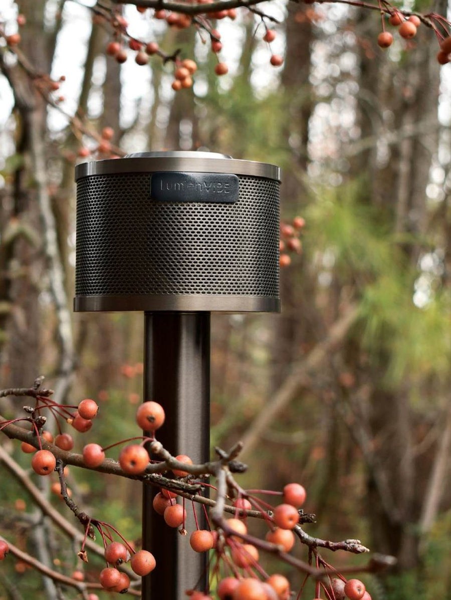 Lumien LV-40W-A LumienVIBE outdoor speaker mounted on brass Quick Connect riser in landscape